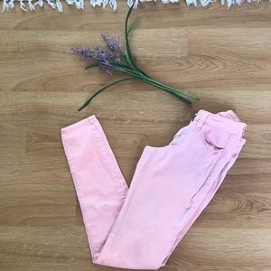 Faded pink skinny jeans